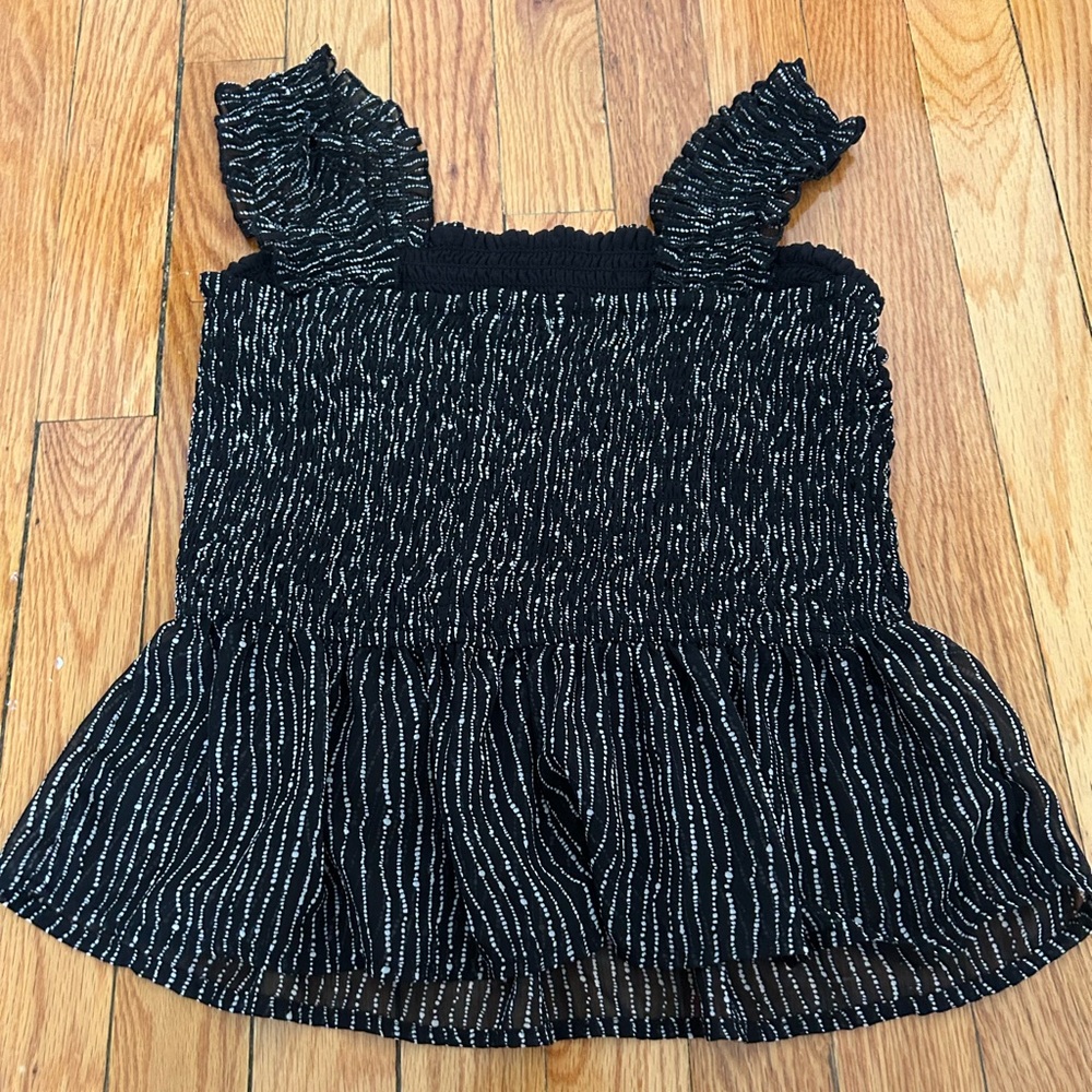 Black and White Women's Peplum top. Size M. Fits small.